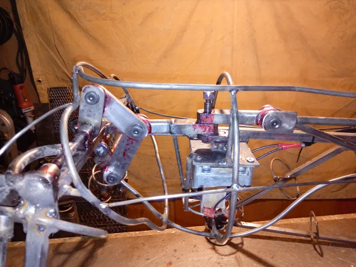Welded-steel armature and servo mechanism of an animatronic, close-up
