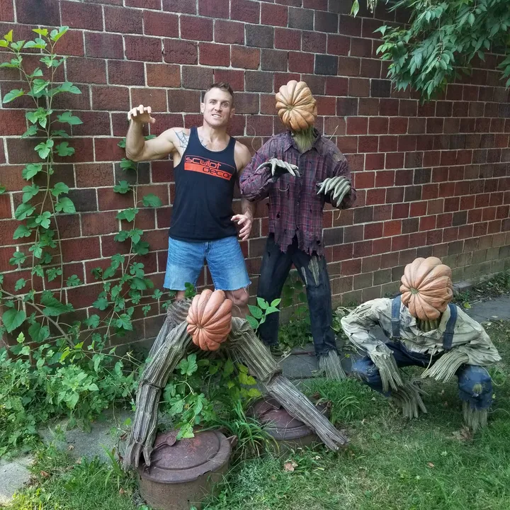 Finished pumpkin-headed scarecrow animatronic figures by SculptDecor