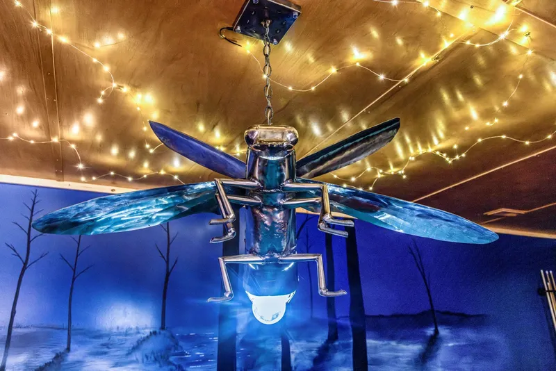 Blue-patina metal dragonfly hanging light fixture