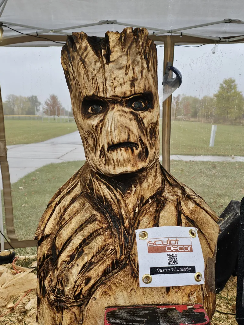 Carved wood Groot bust by Dustin Weatherby with a SculptDecor placard