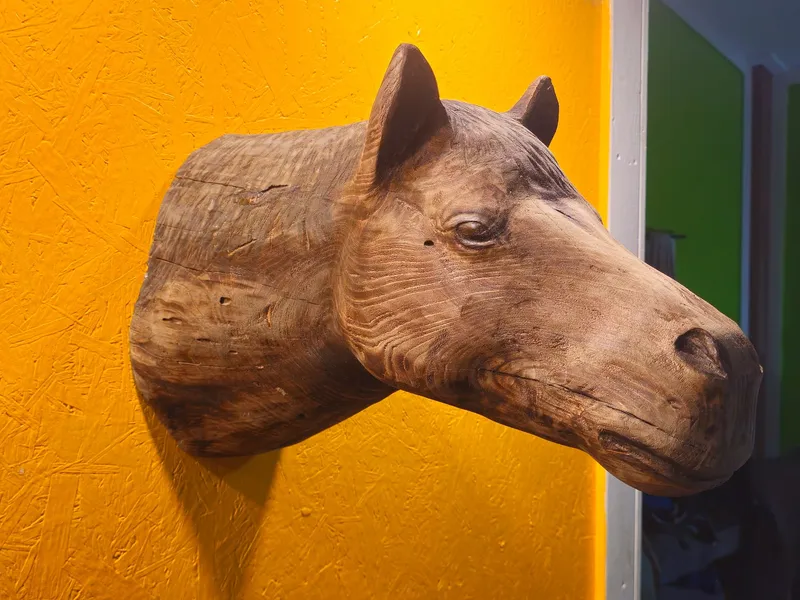 Wall-mounted carved wood horse head