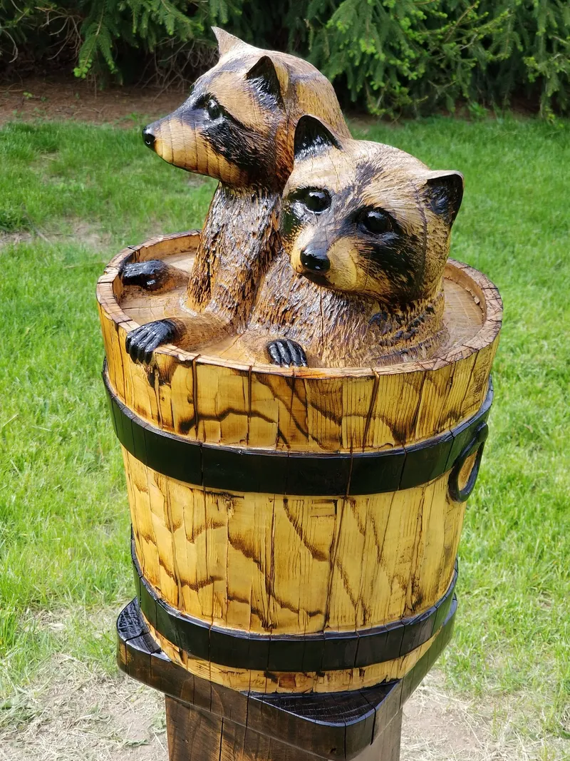 Ash Tree Stump Carving of Raccoons in a Bucket